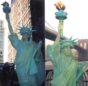 Side by side images of a performer dressed and painted as the Statue of Liberty posing against scenes of New York City in the statue's classic pose.
